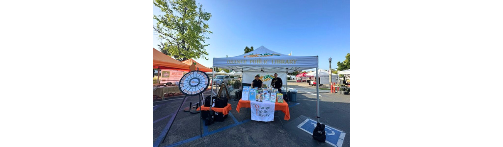 Photo of OPL staff at Pop Up Library HomeGrown Farmers Market