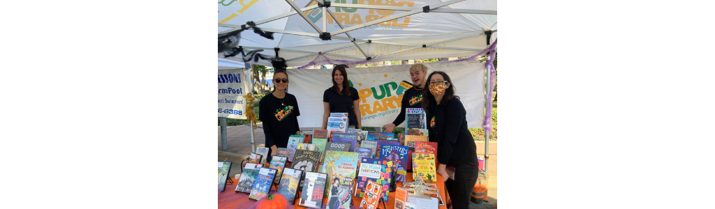 Photo of OPL staff at Pop Up Library Halloween